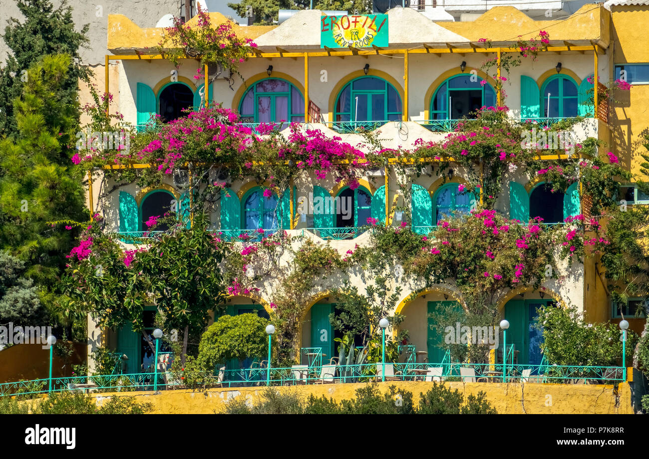 Hotel facade of Hotel EROFILI with blooming hibiscus (Hibiscus) in Agia Galini, Europe, Crete, Greece Stock Photo