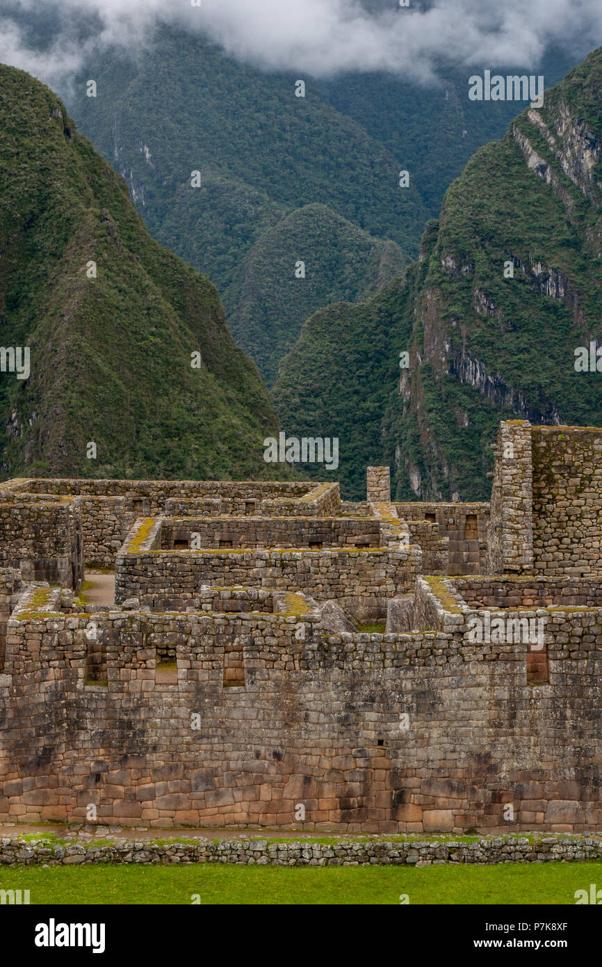 Vertical view of Machu Picchu stone ruins lost in the wild nature of ...