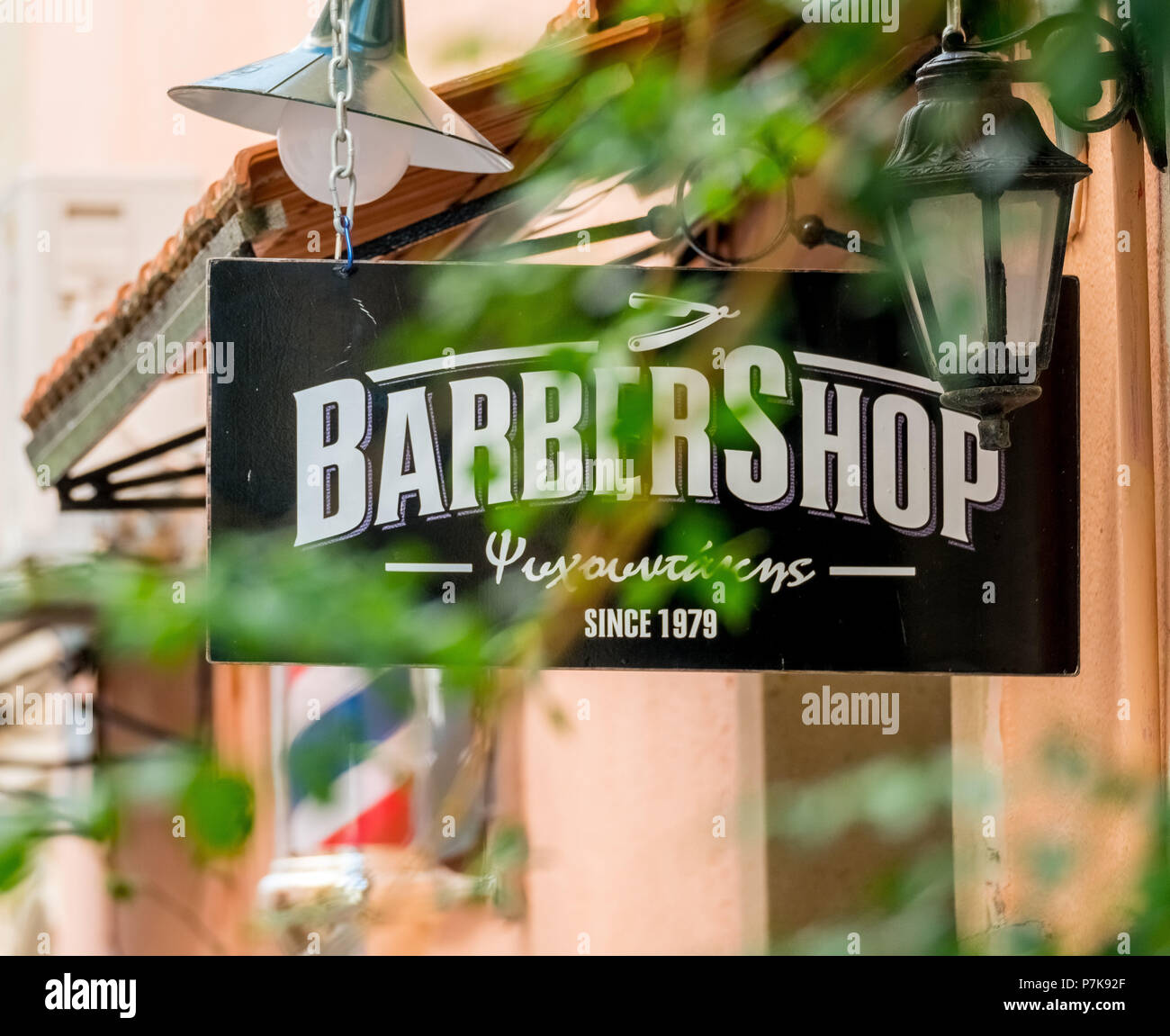 Billboards Barbershop at a barber shop in the old town of Rethymno, Europe, Crete, Greece Stock Photo
