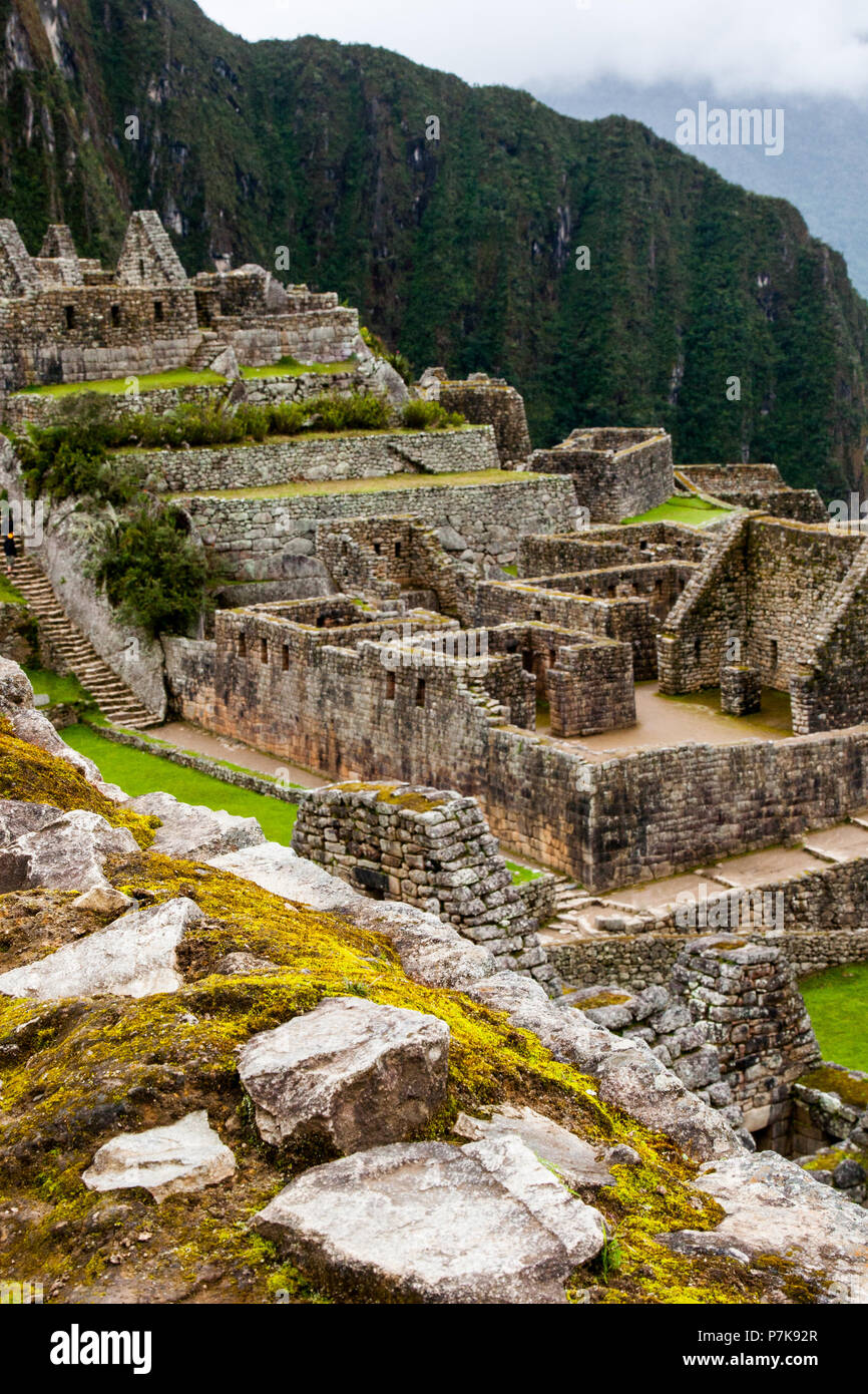 Vertical view of Machu Picchu stone ruins lost in the wild nature of ...