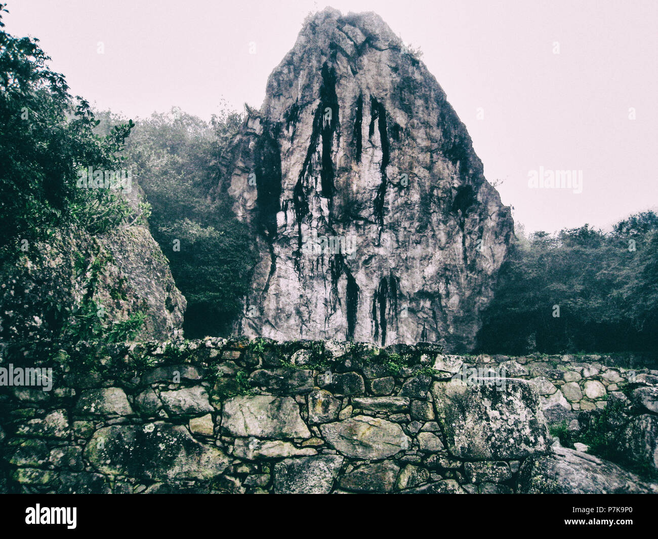 Stone magical ancient ruins along the paved path Inca Trail to Machu ...