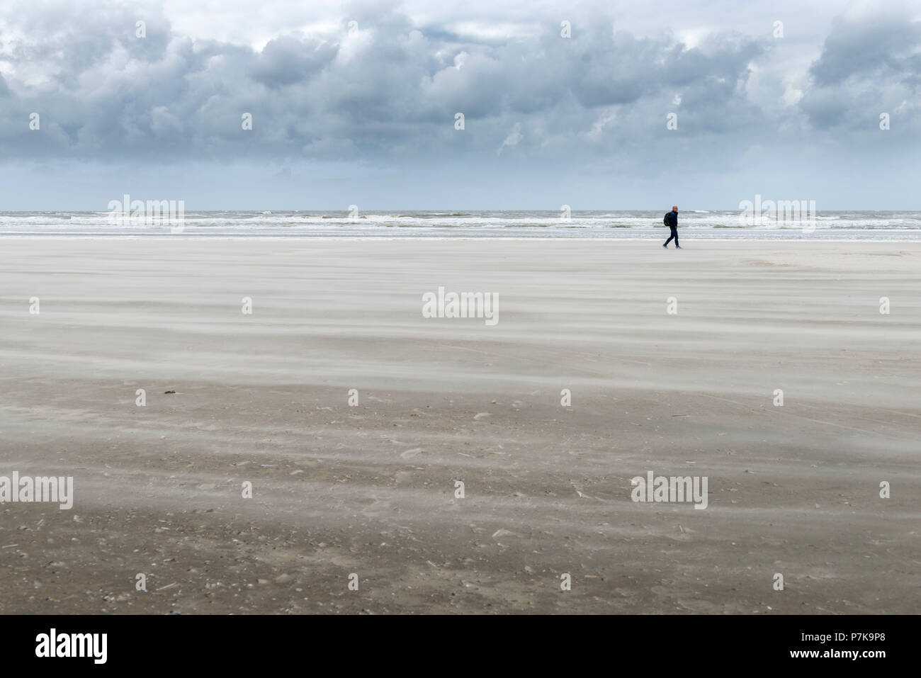Germany, Lower Saxony, East Frisia, Juist, beach walk in stormy weather. Stock Photo