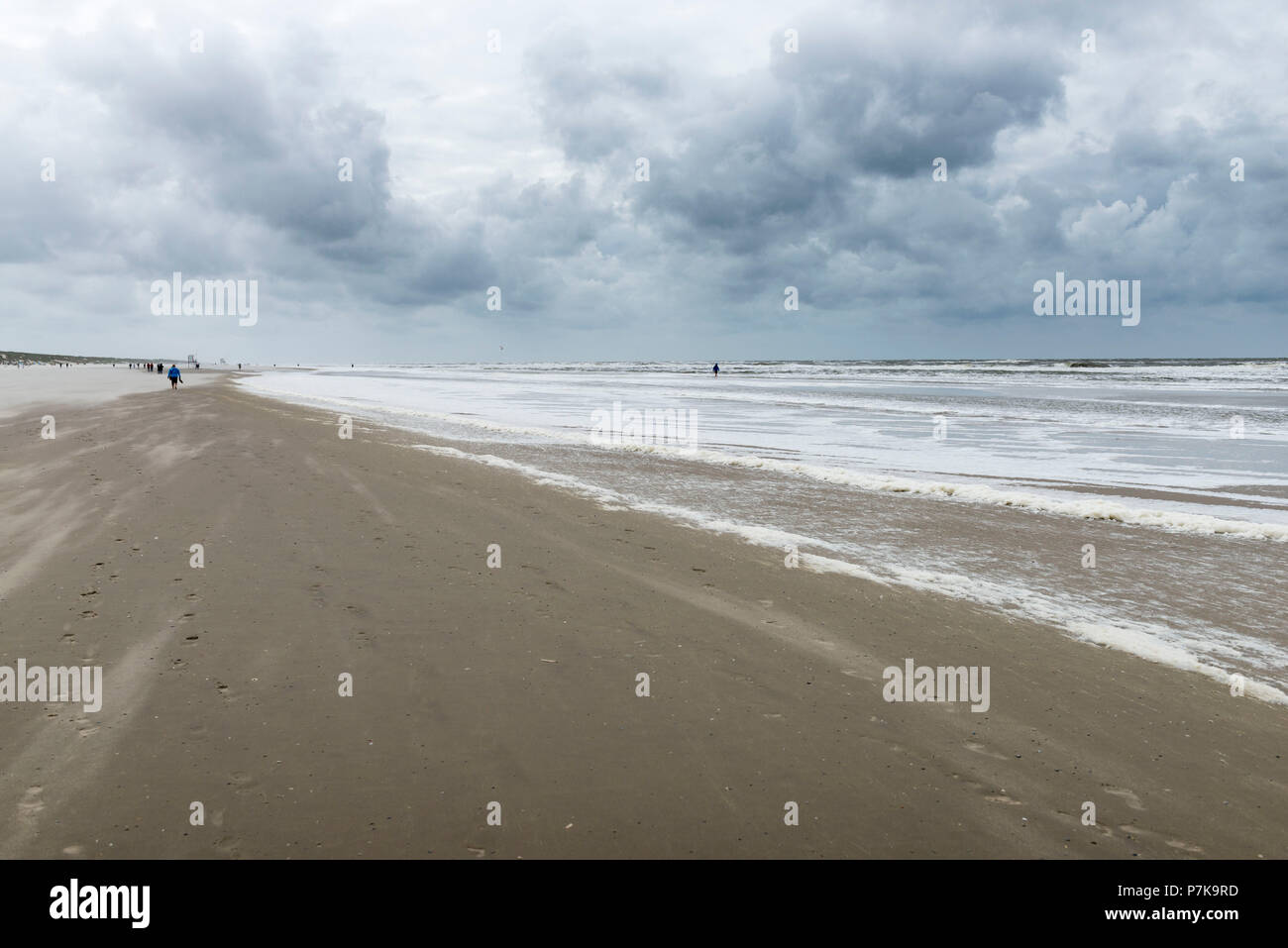 Germany, Lower Saxony, East Frisia, Juist, beach walk in stormy weather. Stock Photo
