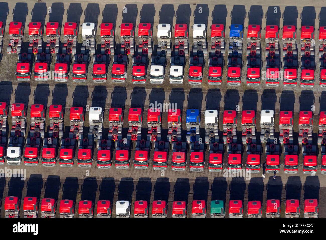 Aerial photo, lines of red tractor units, Mercedes-Benz, Mercedes trucks, tractor units, truck park for new trucks on the site of 'Recklinghausen-Hochlarmark', former 'Zeche Recklinghausen Schacht II', Herten, Ruhr area, North Rhine-Westphalia, Germany, Europe Stock Photo