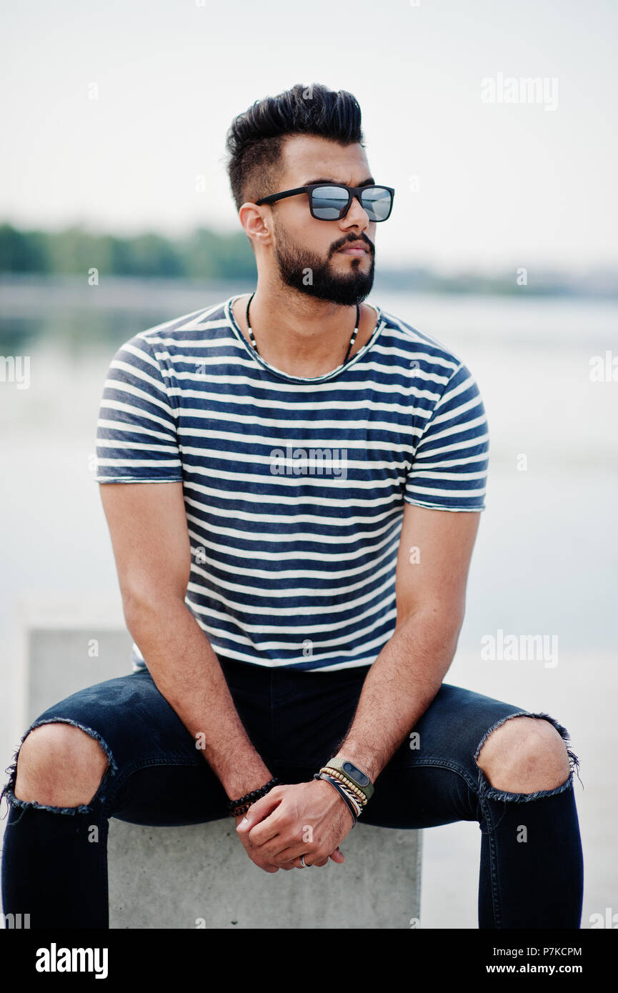 Handsome tall arabian beard man model at stripped shirt posed outdoor.  Fashionable arab guy at sunglasses Stock Photo - Alamy