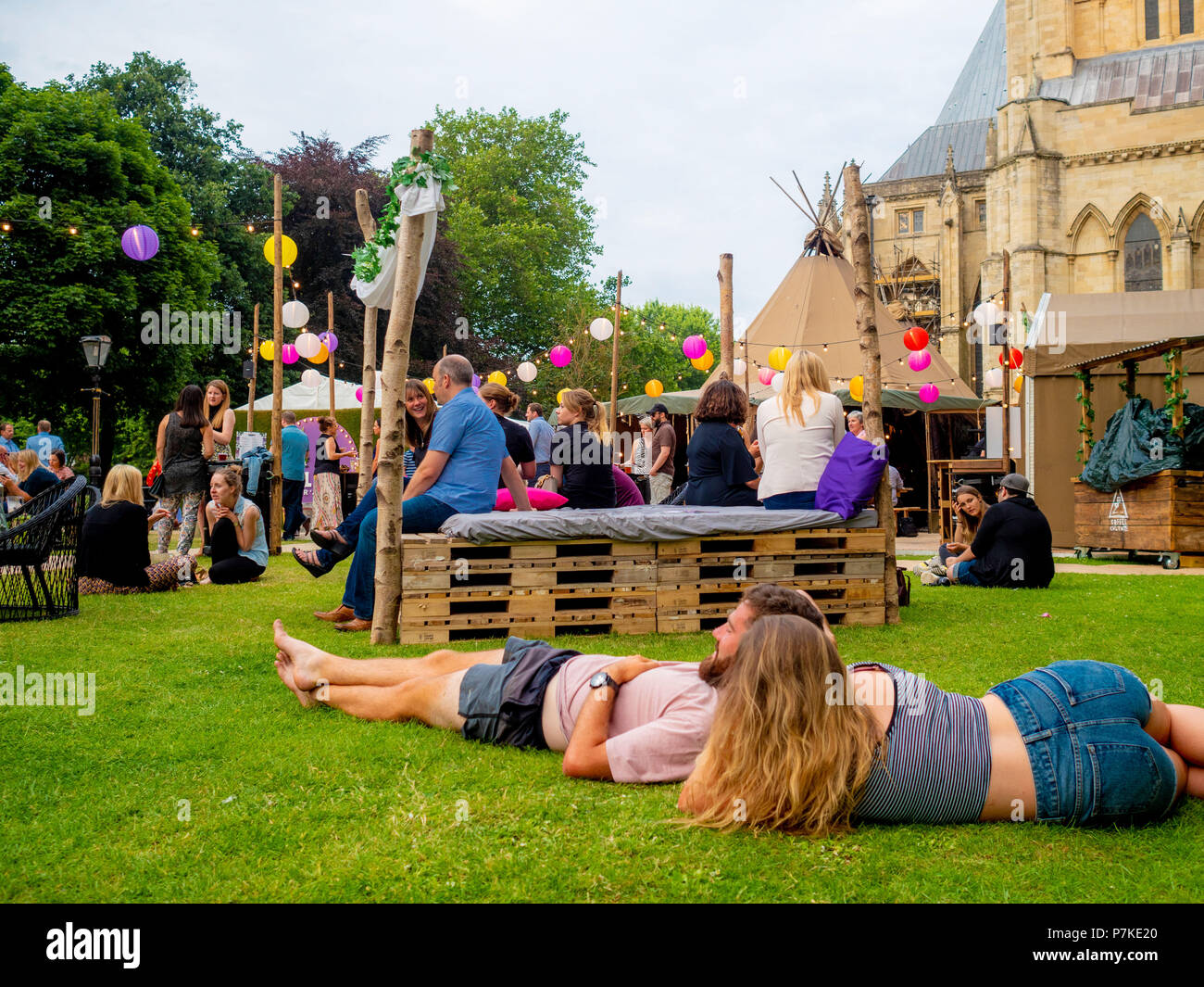 York, UK. 6th July 2018. SÓL ÁST – the pop-up bar with a summery vibe – begins a two month residency in the shadows of York Minster. Two linked canvas tipis adorned with greenery and lanterns form the unique venue, combining indoor cosiness with a unique summer theme set against one of the world’s most spectacular gothic backdrops. The event is part of the “Summer in the Park: Heart of Yorkshire” festival that is being hosted the Dean’s Park by York Minster throughout the summer. Credit: Bailey-Cooper Photography/Alamy Live News Stock Photo