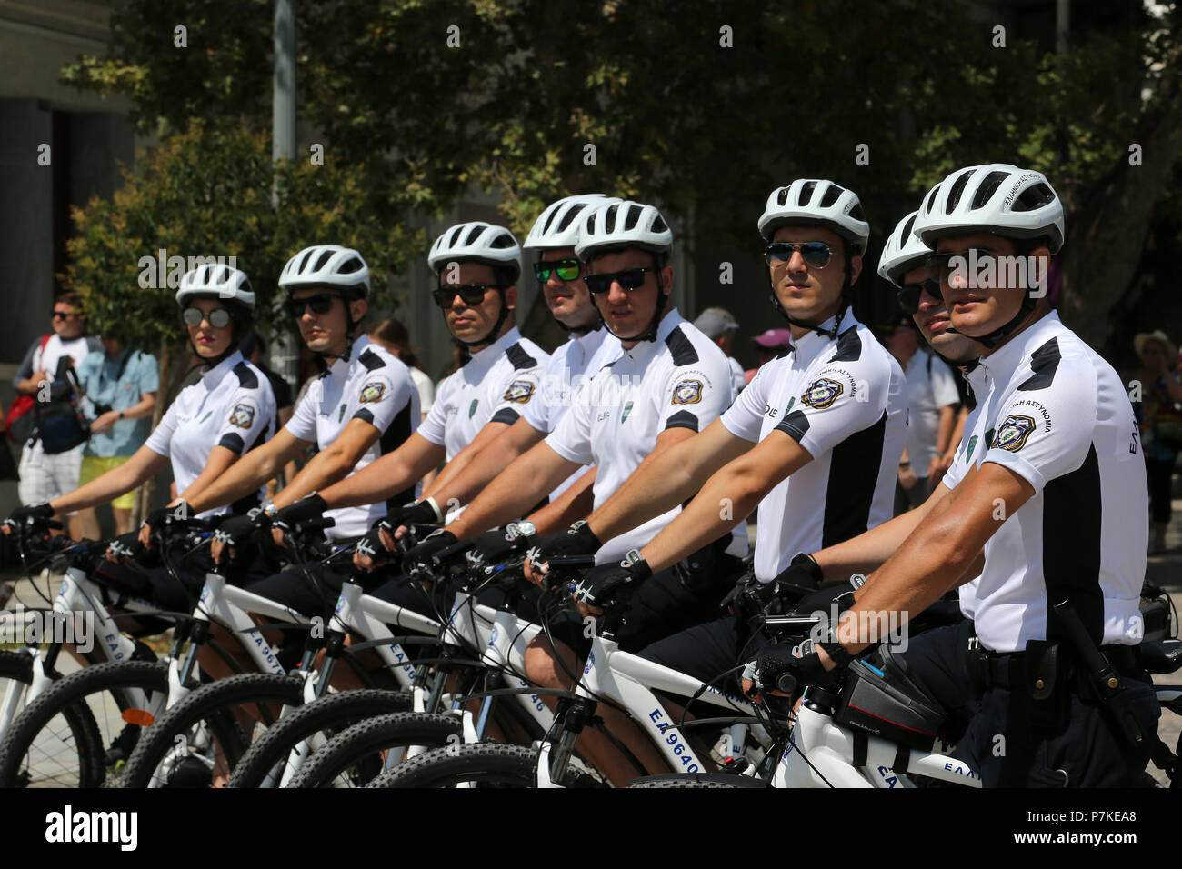 Athens, Greece. 6th July, 2018. A Greek bicycle police team pose for a  photo near the Acropolis, in Athens, Greece, on July 6, 2018. Created in  2015, bicycle police belong to the