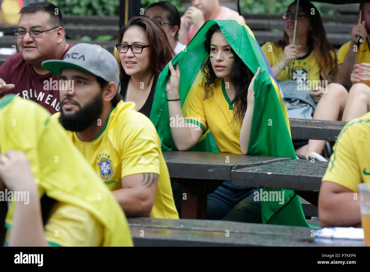 Astoria, New York, USA, July 06 2018 - Brazilian fans during the 2018 World Cup match between Brazil and Belgium today at Studio Square NYC beer garden in Long Island City. Photos: Luiz Rampelotto/EuropaNewswire | usage worldwide Credit: dpa picture alliance/Alamy Live News Stock Photo