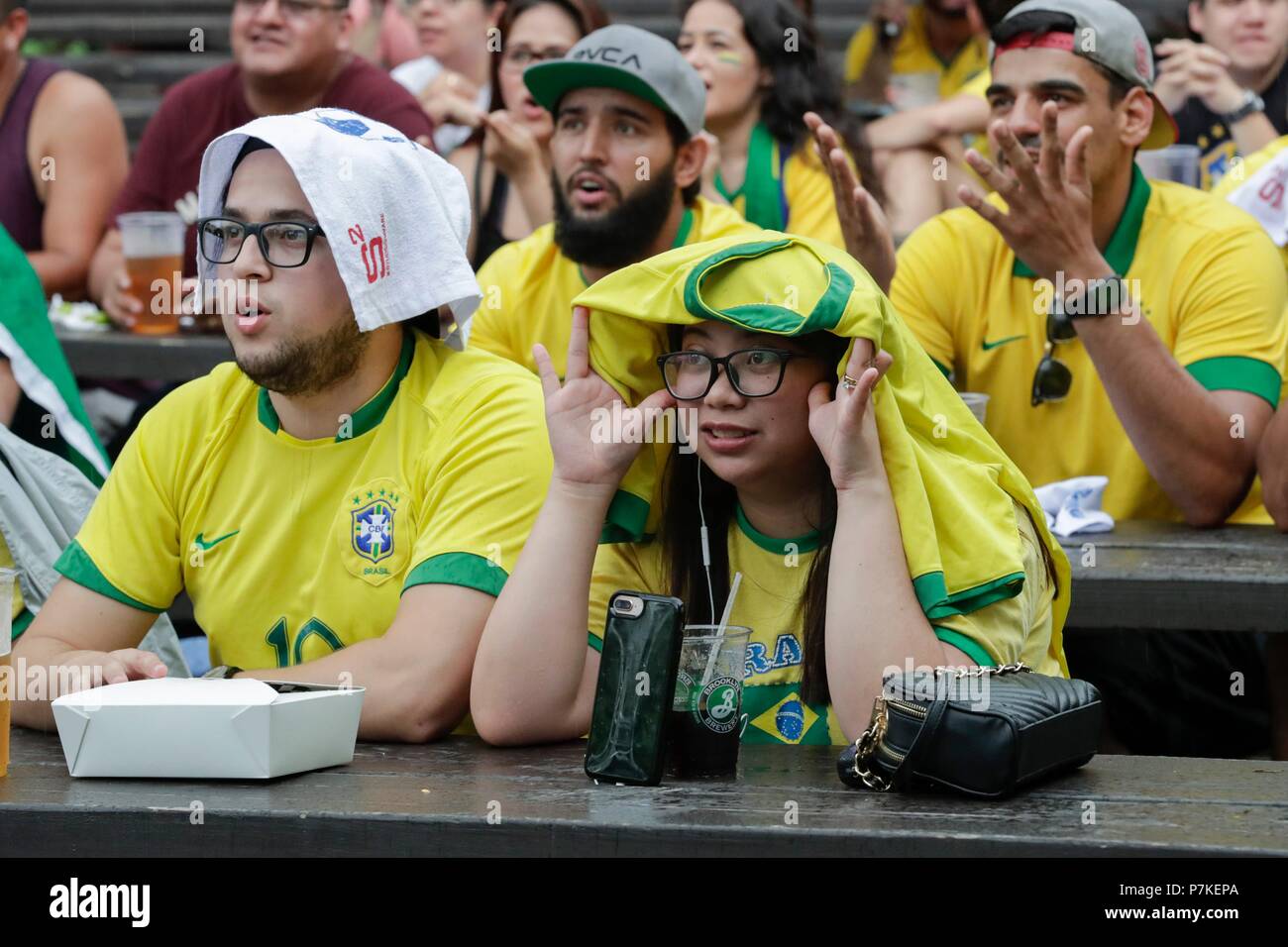 Astoria, New York, USA, July 06 2018 - Brazilian fans during the 2018 World Cup match between Brazil and Belgium today at Studio Square NYC beer garden in Long Island City. Photos: Luiz Rampelotto/EuropaNewswire | usage worldwide Credit: dpa picture alliance/Alamy Live News Stock Photo