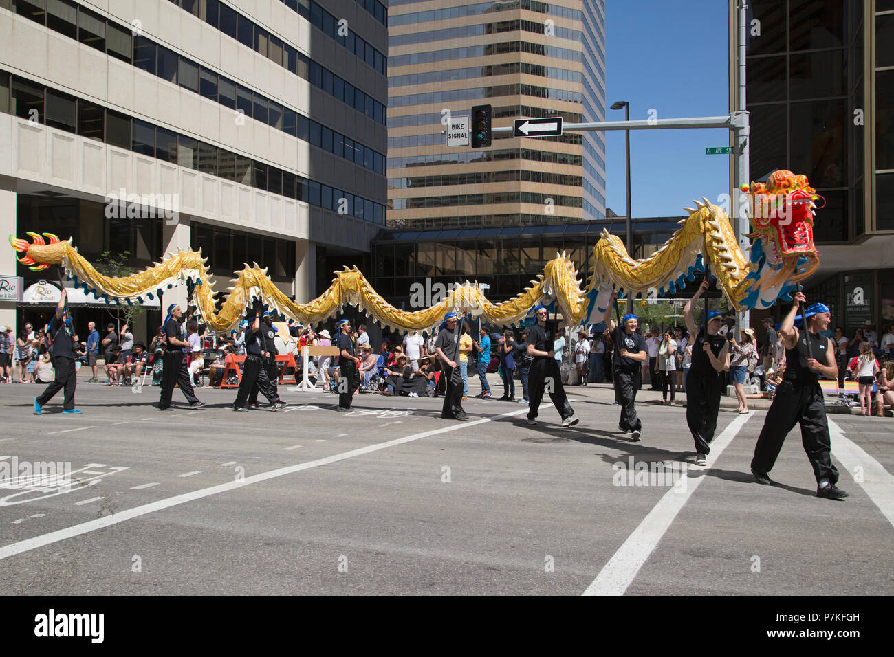 Calgary, Canada. 6th July, 2018.  Calgary Chinese community marching with a dragon in the Calgary Stampede Parade. The parade through downtown kicks off the Calgary Stampede each year. Rosanne Tackaberry/Alamy Live News Stock Photo