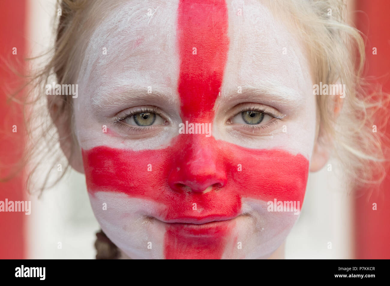 A young England fan from the Kirby Estate in Bermondsey gets face painted with Flag of England colours ready for FIFA World Cup 2018 Stock Photo