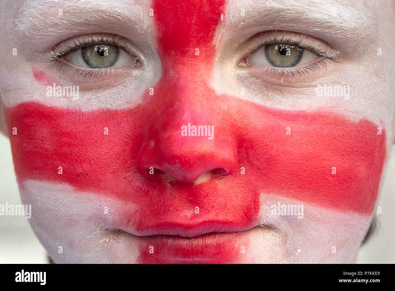 A young England fan from the Kirby Estate in Bermondsey gets face painted with Flag of England colours ready for FIFA World Cup 2018 Stock Photo