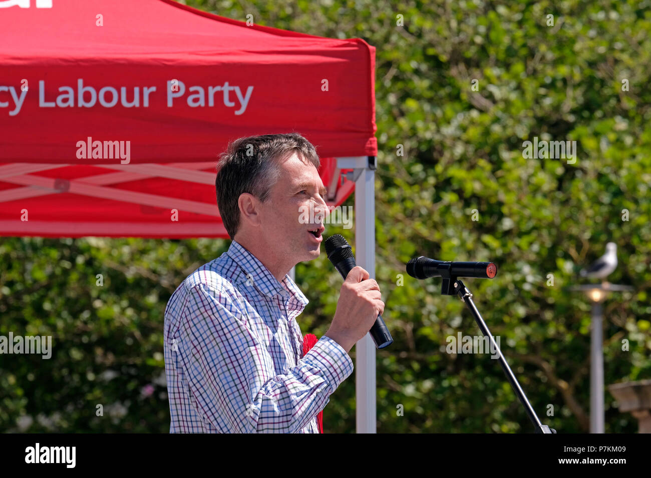 Weston-super-Mare, UK. 7th July, 2018. Tim Taylor of Weston Constituency Labour Party, speaks at a demonstration against the overnight closure of the accident and emergency department at Weston General Hospital. Despite assurances that the closure is only a temporary measure, it has been in effect since July 2017, and many people in the area are concerned that it is the prelude to further cuts. Keith Ramsey/Alamy Live News Stock Photo