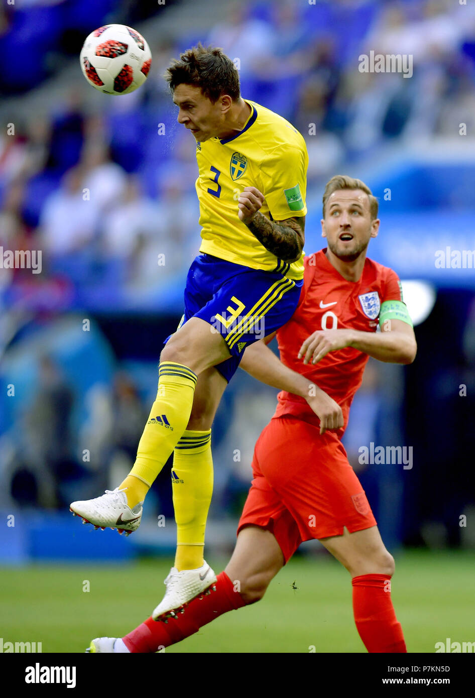 Samara, Russia. 7th July, 2018. Harry Kane (R) of England vies with Victor Lindelof of Sweden during the 2018 FIFA World Cup quarter-final match between Sweden and England in Samara, Russia, July 7, 2018. Credit: Chen Yichen/Xinhua/Alamy Live News Stock Photo