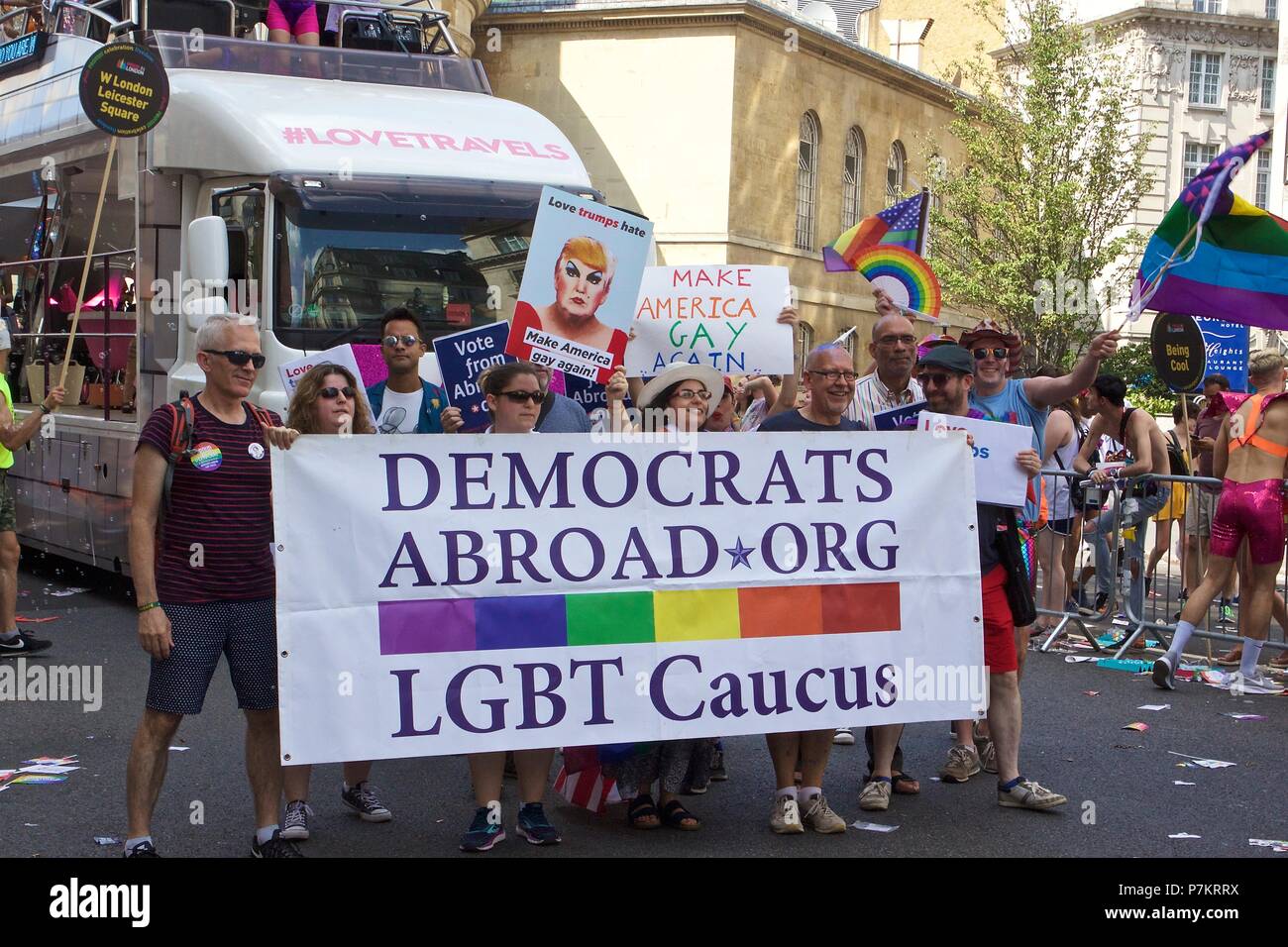 London, UK. 7th July 2018. Pride celebrations in London Democrats Abroad Org LGBT Caucus at the Pride in London 2018 Parade in London with signs such as 'Make America Gay Again' and 'Love trumps hate'. They are joined by more than 1 million attending the march today to celebrate LGBT+ Credit: Dimple Patel/Alamy Live News Stock Photo