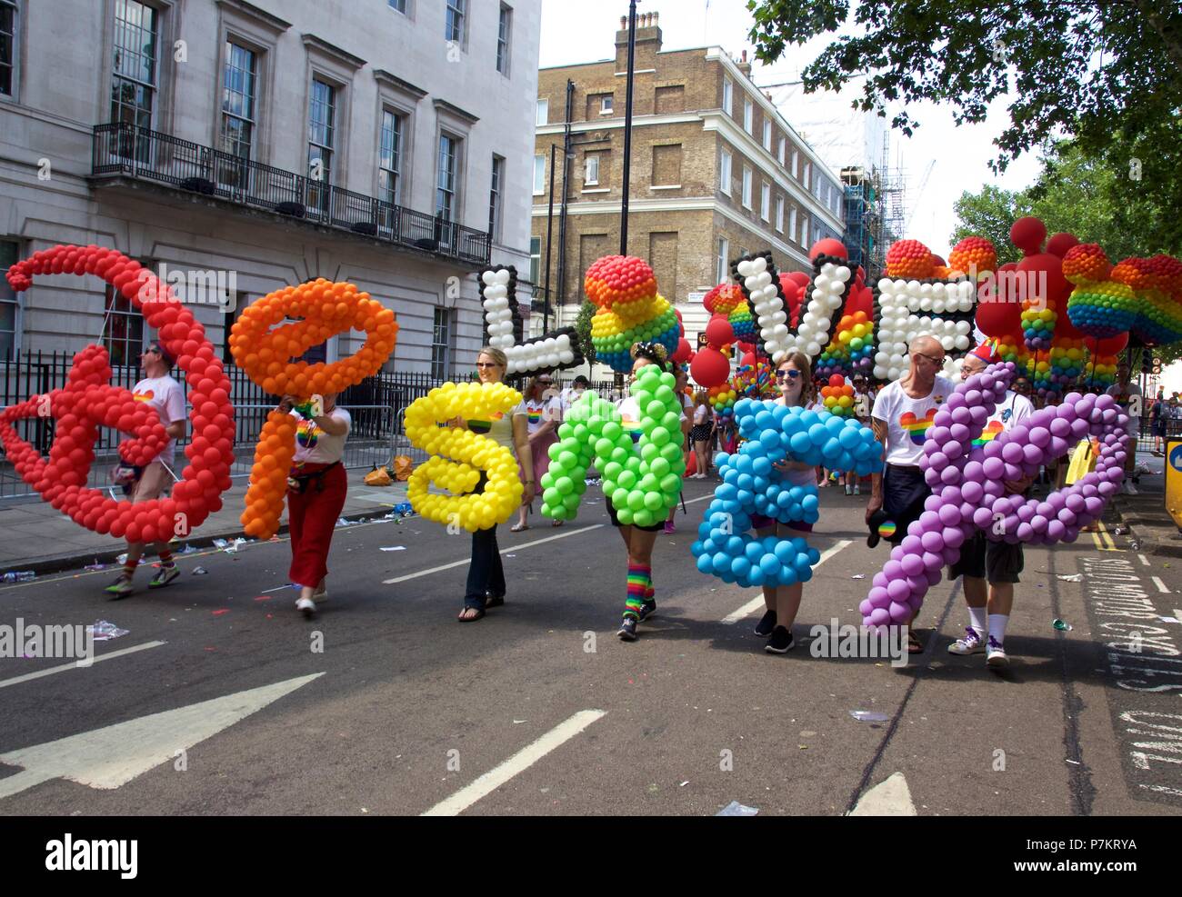 London, UK. 7th July 2018. Pride celebrations in London London, UK. 7th July 2018. Disney at the Pride in London parade 2018. with their name spelt out in rainbow coloured balloons, LOVE spelt out in balloons and Mickey Mouse rainbow balloons. They join more than 1 million attending the march today to celebrate LGBT+. Credit: Dimple Patel/Alamy Live News Stock Photo