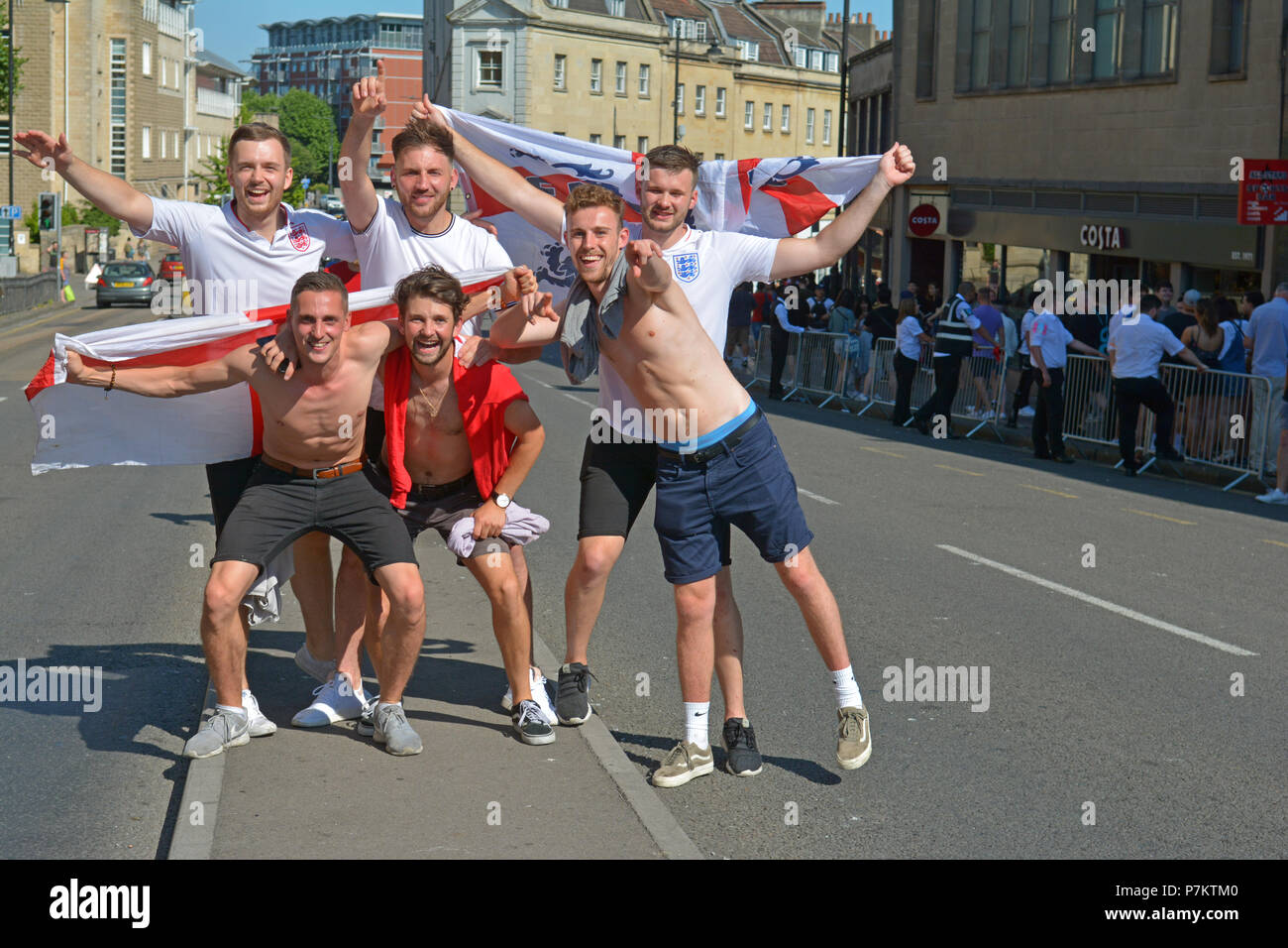 Bristol, UK. 7th July 2018. England football fans celebrating there win after beating Sweden 2-0. On a very hot afternoon fans poured out of the pubs and food bars onto the main road at the Top of Park street in Bristol. Robert Timoney/Alamy/Live/News Stock Photo