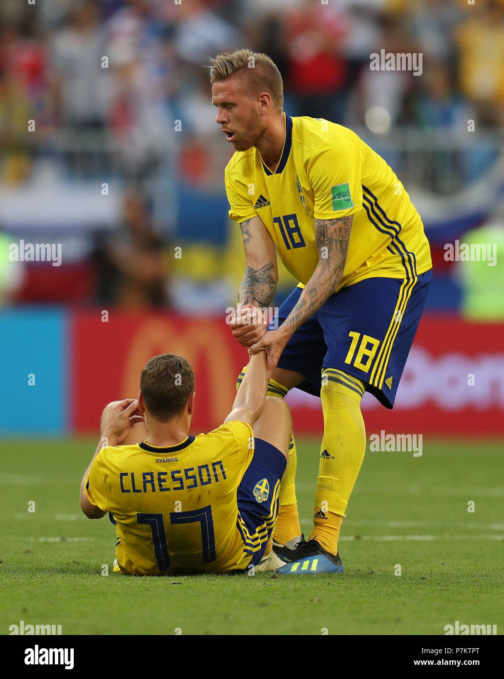 Samara, Russia. 7th July, 2018. Sweden's Pontus Jansson (R) pulls up Viktor Claesson after the 2018 FIFA World Cup quarter-final match between Sweden and England in Samara, Russia, July 7, 2018. England won 2-0 and advanced to the semi-finals. Credit: Lu Jinbo/Xinhua/Alamy Live News Stock Photo