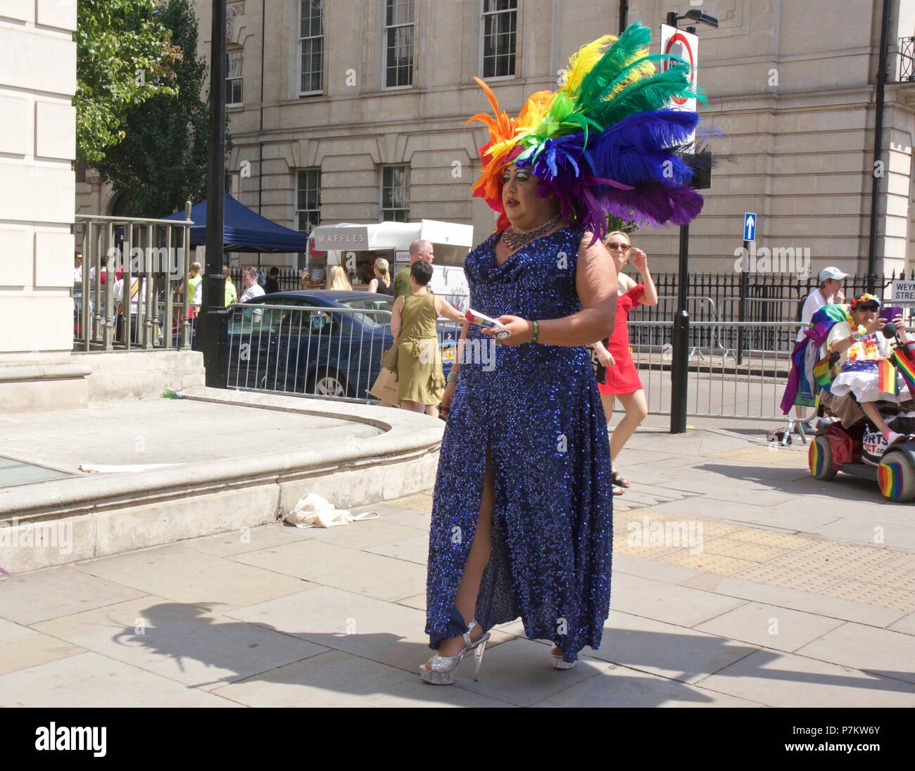 London, UK. 7th July 2018. Pride celebrations in London. A drag queen with rainbow feathers at Pride in London 2018 Parade.  Credit: Dimple Patel/Alamy Live News Stock Photo