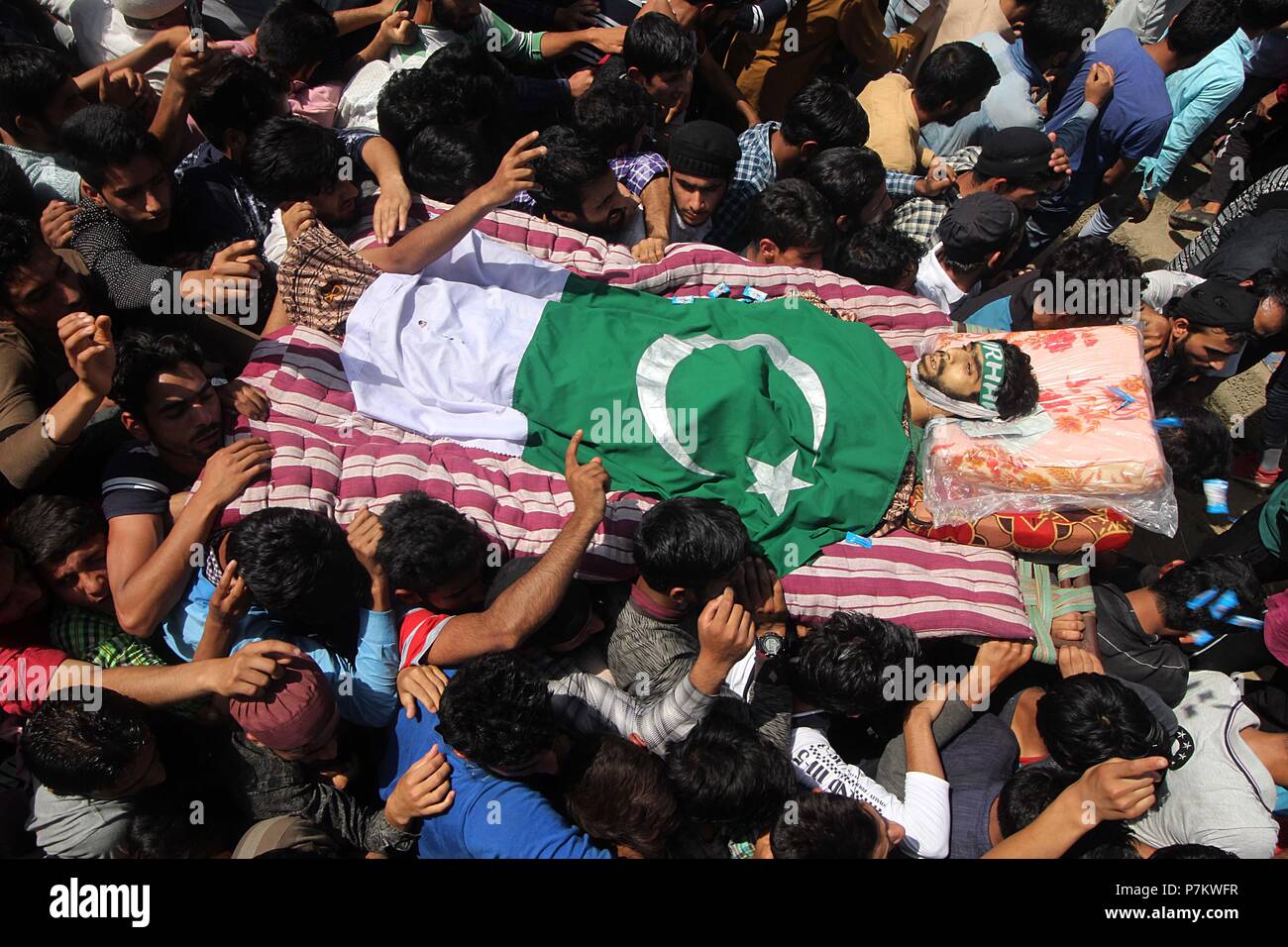 Kulgam, Jammu and Kashmir, India. 7th July, 2018. People carry the dead body of 22 yrs old civilian Shakir Ahmad during his funeral in Hawoora area of Kulgam some 60 kilometers from Srinagar the summer capital of Indian controlled Kashmir on July 07, 2018. Three civilians, including a teenage girl, were killed and at least five others injured after Indian army opened fire on civilians in south Kashmir's Kulgam district on June 07. Credit: Faisal Khan/ZUMA Wire/Alamy Live News Stock Photo