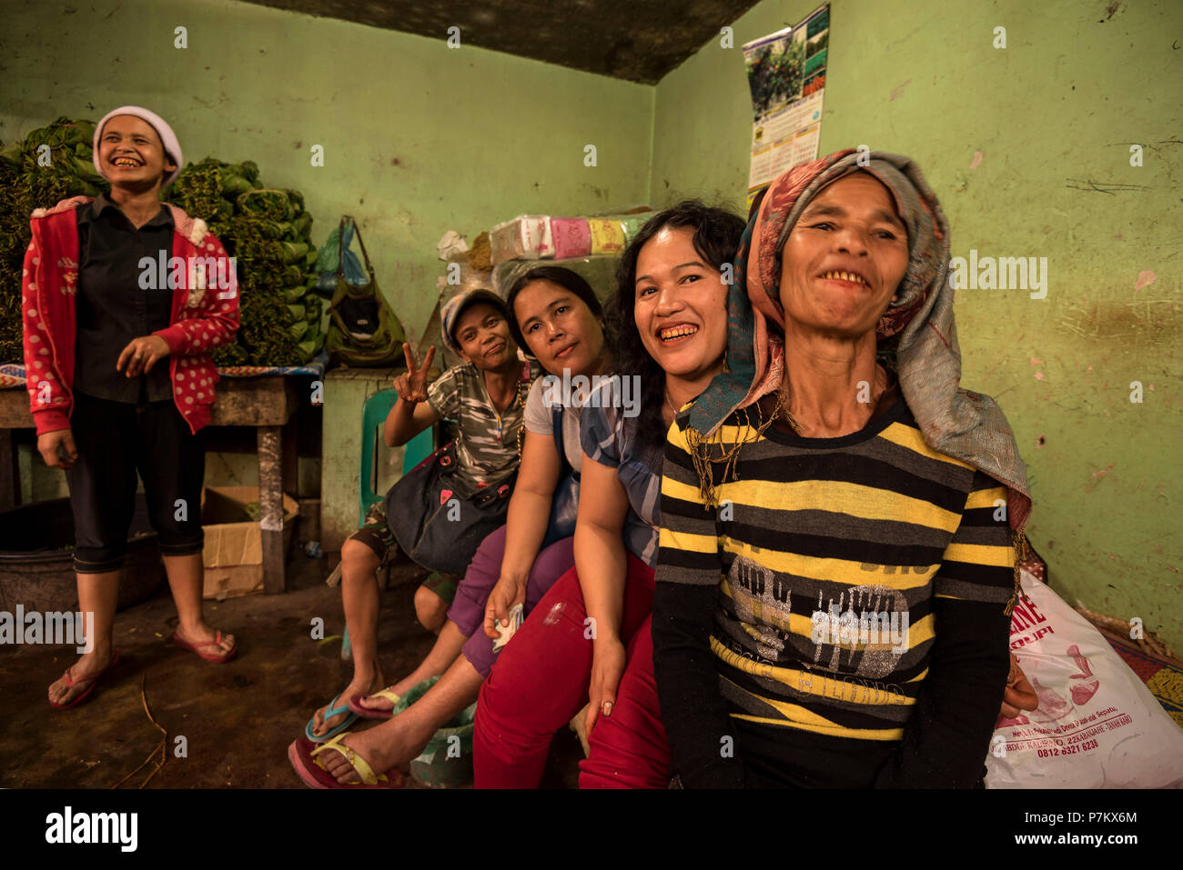 Friendly market traders in a betel nut shop, all have the distinct look of betel nut addicts, Stock Photo