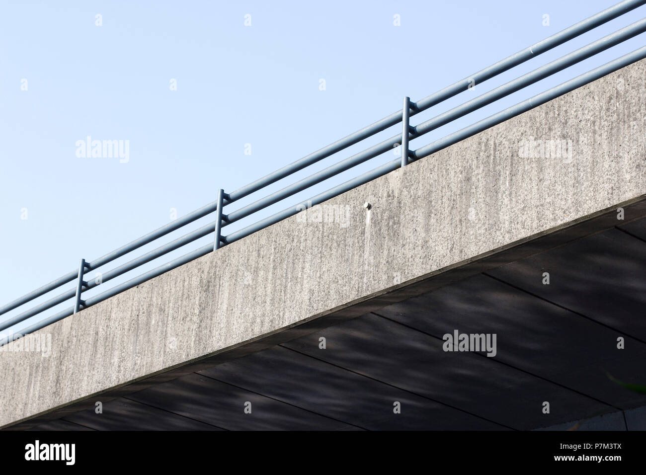 Emerging lines and reflections of the water at the Torminbrücke in Münster Stock Photo