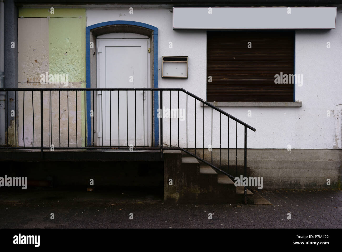 A closed down restaurant with lowered window blinds. Stock Photo