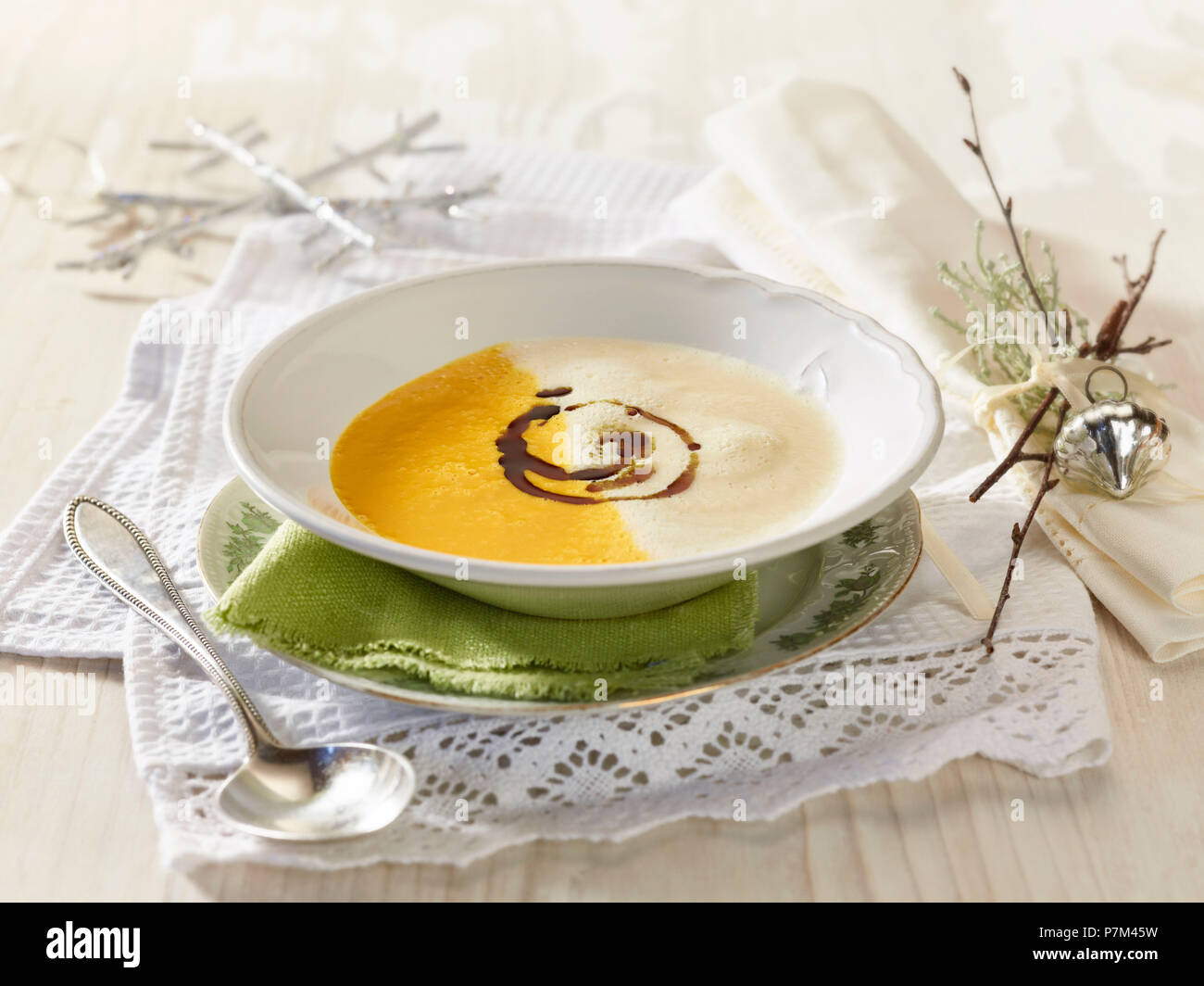 Two-colored pumpkin celery cream soup Stock Photo