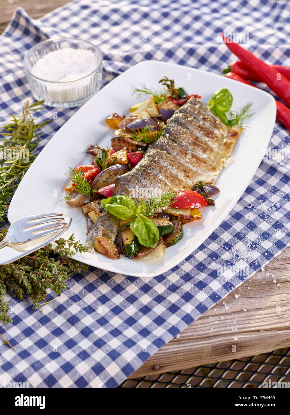 grilled trout fillet with Mediterranean vegetables Stock Photo
