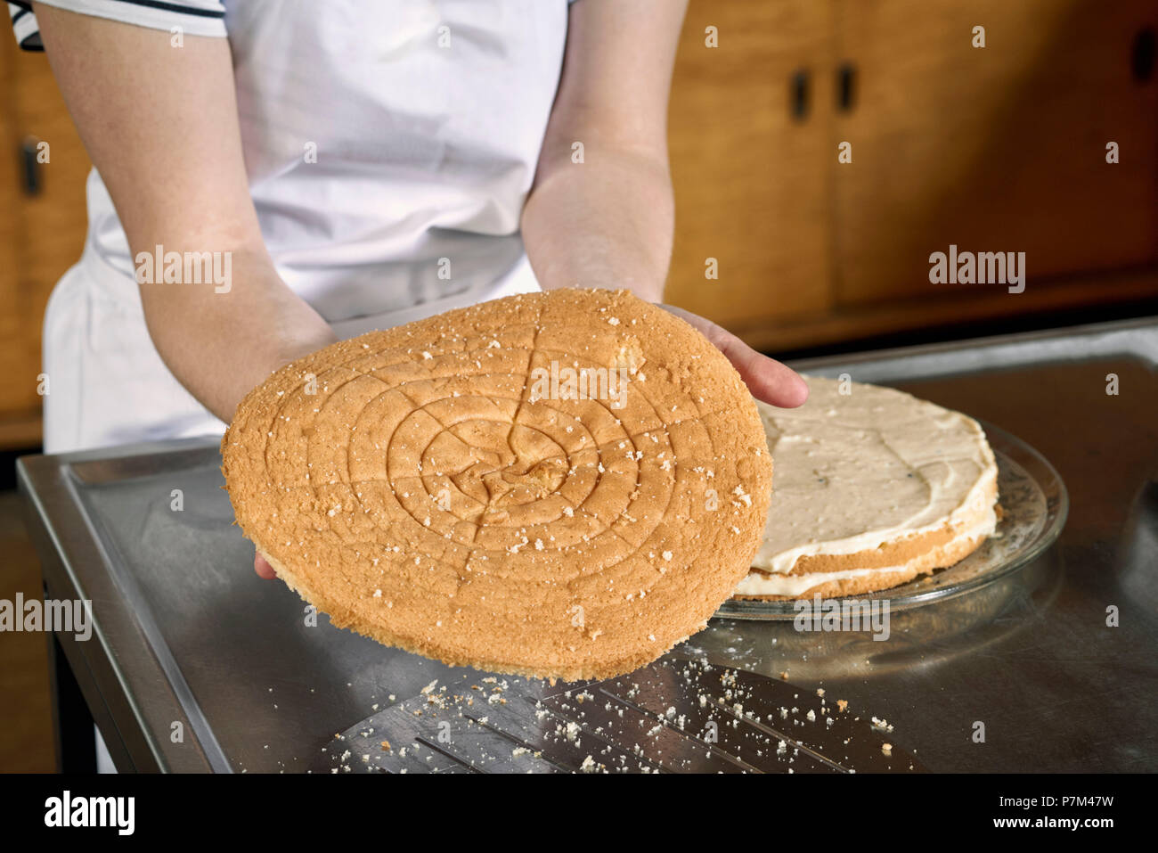 Layering Raspberry Steps to make a raspberry cake, layering biscuit dough Stock Photo - Alamy