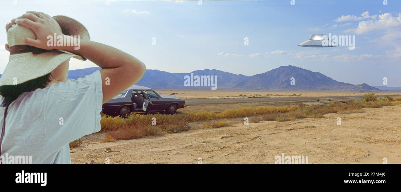 woman watching alien spaceship [M] Stock Photo