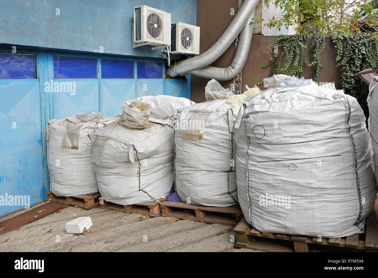 Raw bulk material in sacks at pallets Stock Photo Alamy