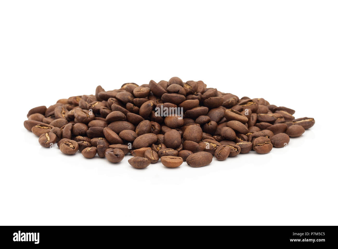 A pile of coffee beans isolated on a white background. Stock Photo
