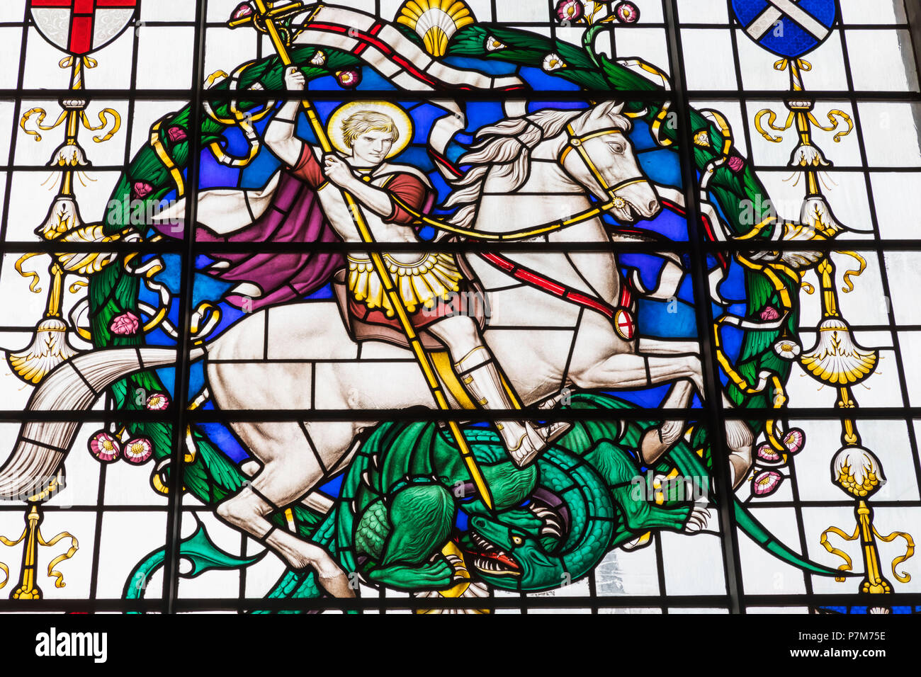 England, London, City of London, Guildhall, St Lawrence Jewry Church, Stained Glass Window depicting St George and the Dragon Stock Photo