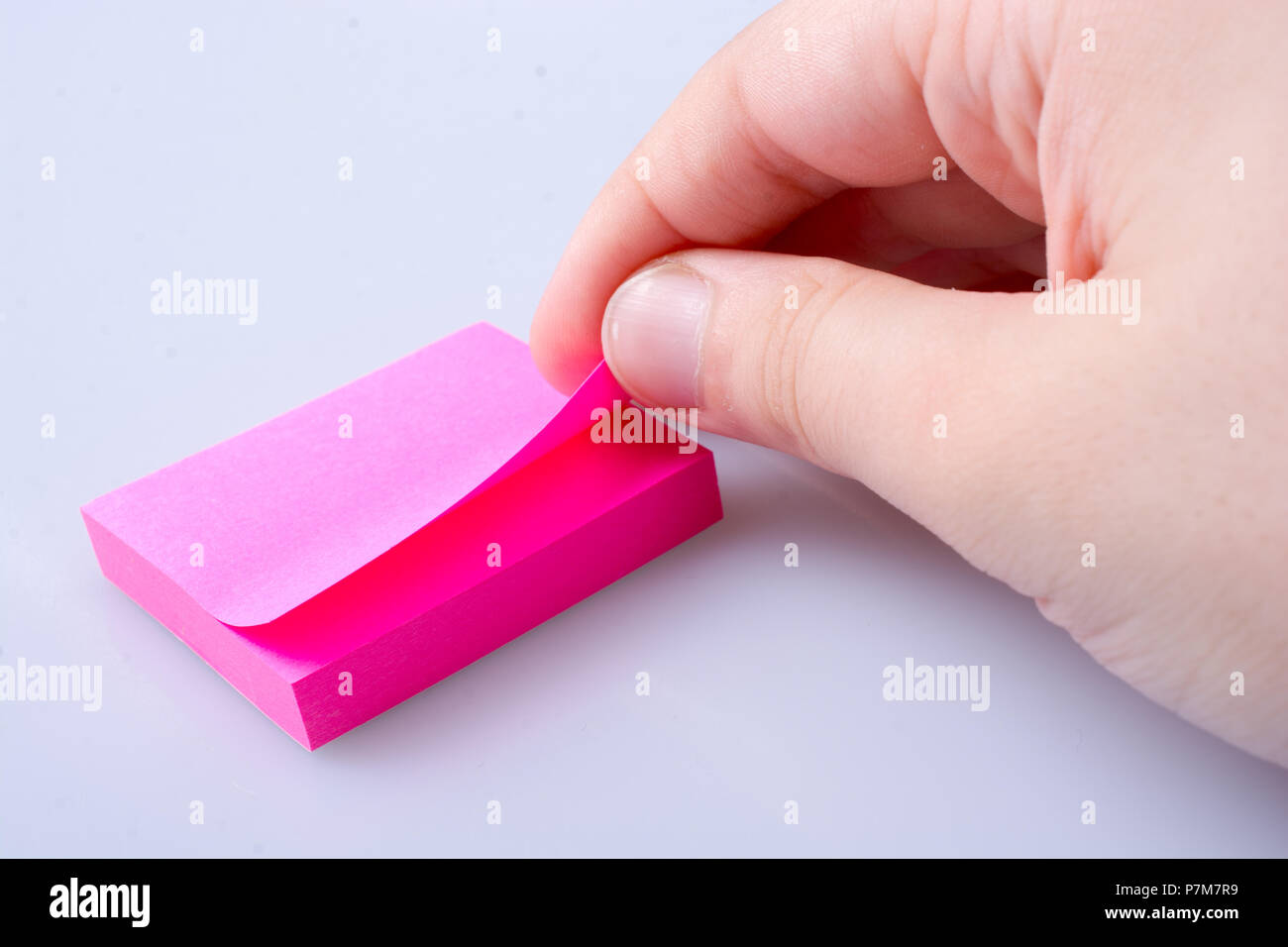 Handing Notes Sticker Post note office sticker for taking notes in hand Stock Photo - Alamy