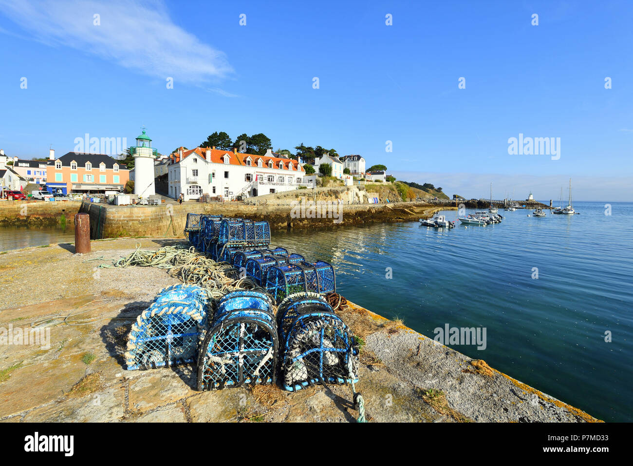 France, Morbihan, Belle Ile en Mer, Sauzon harbour with Phare Hotel and lighthouse Stock Photo