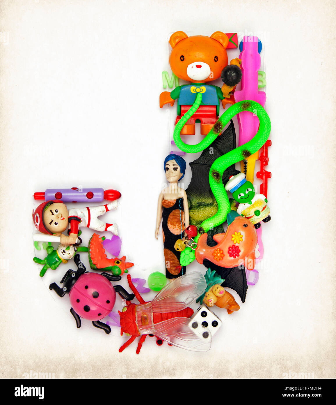 the letter J made from small toys Stock Photo Alamy