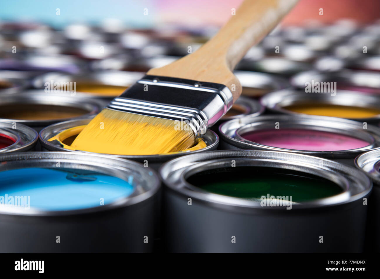 Group of tin metal cans with color paint Stock Photo - Alamy