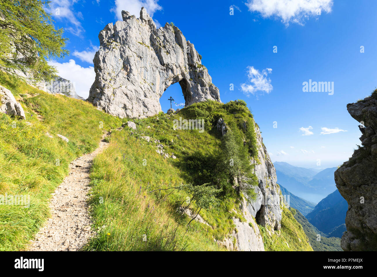 A path leads to Porta di Prada, a rock natural arch in the Grigna group,  Grigna Settentrionale / Grignone, Northern Grigna Regional Park, Lombardy,  Italy, Europe Stock Photo - Alamy