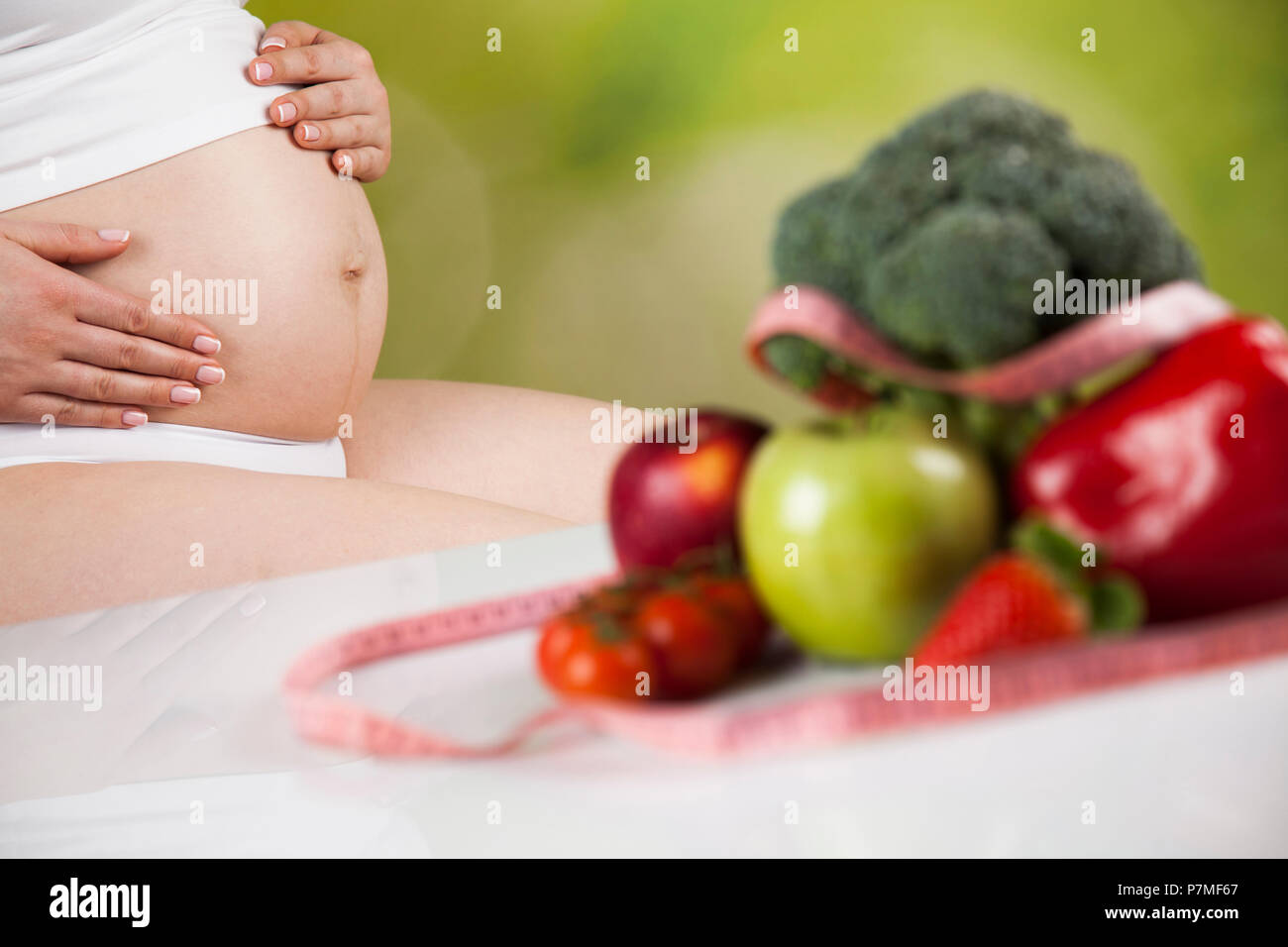 Pregnant woman with fruit and vegetables Stock Photo - Alamy