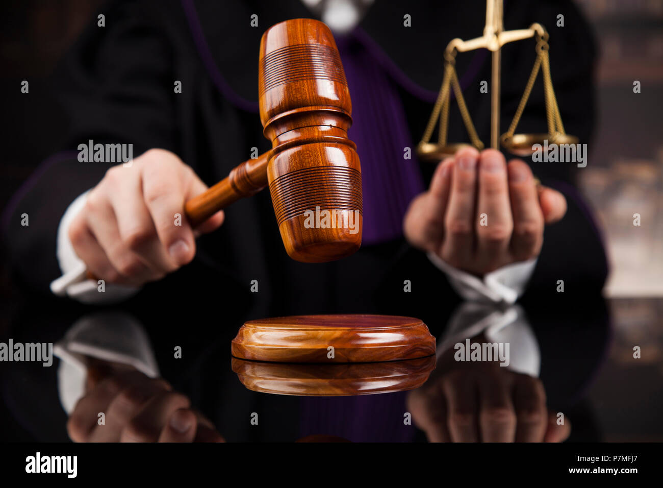 Judge, male judge in a courtroom striking the gavel Stock Photo Alamy