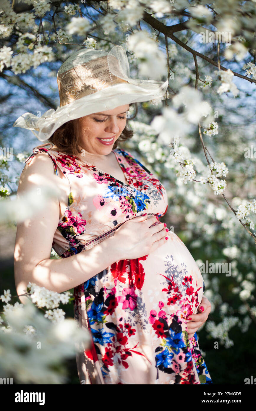 Spring, Young beautiful pregnant woman in the Orchard Stock Photo - Alamy