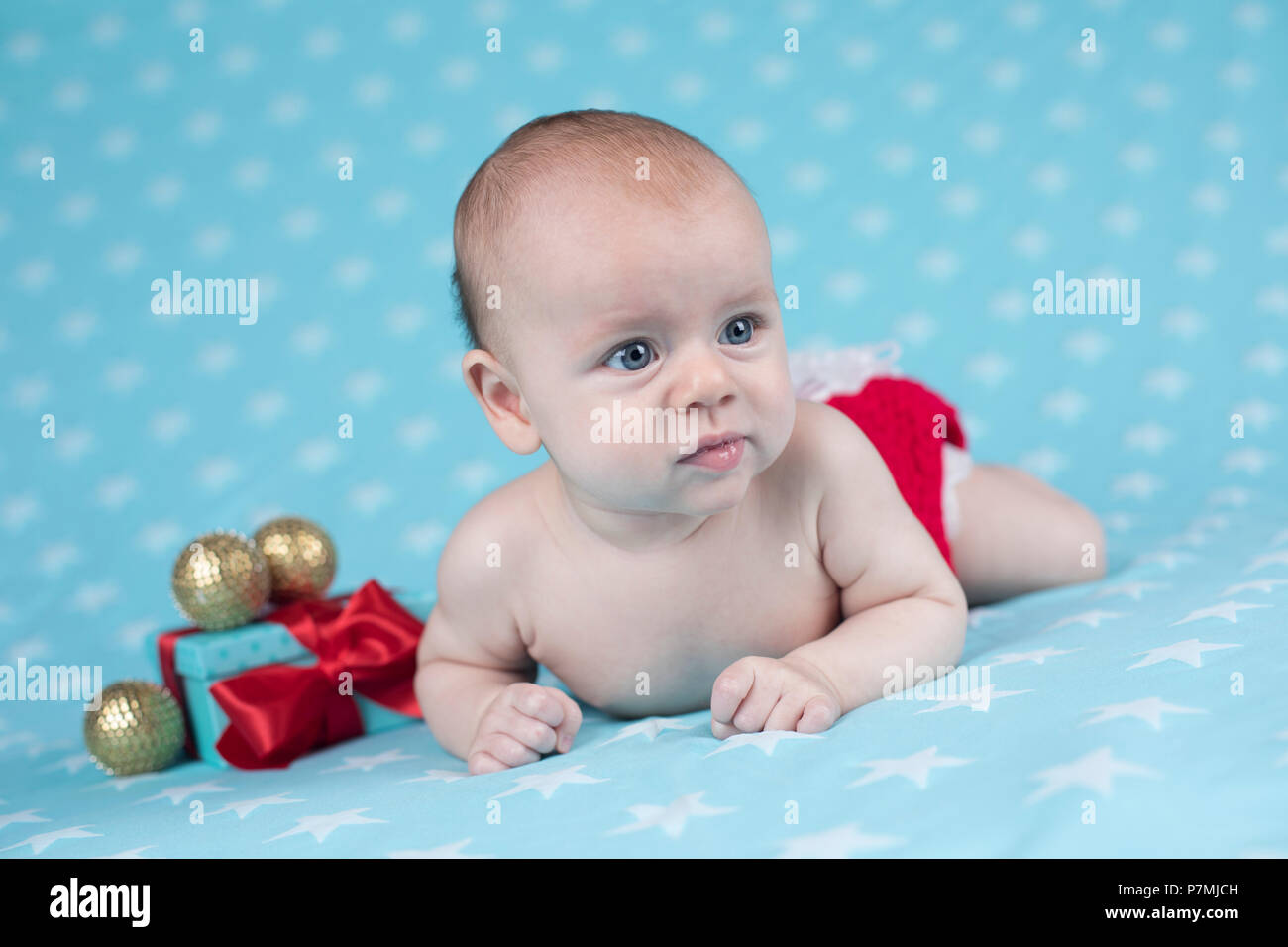 Christmas baby crawling Stock Photo - Alamy