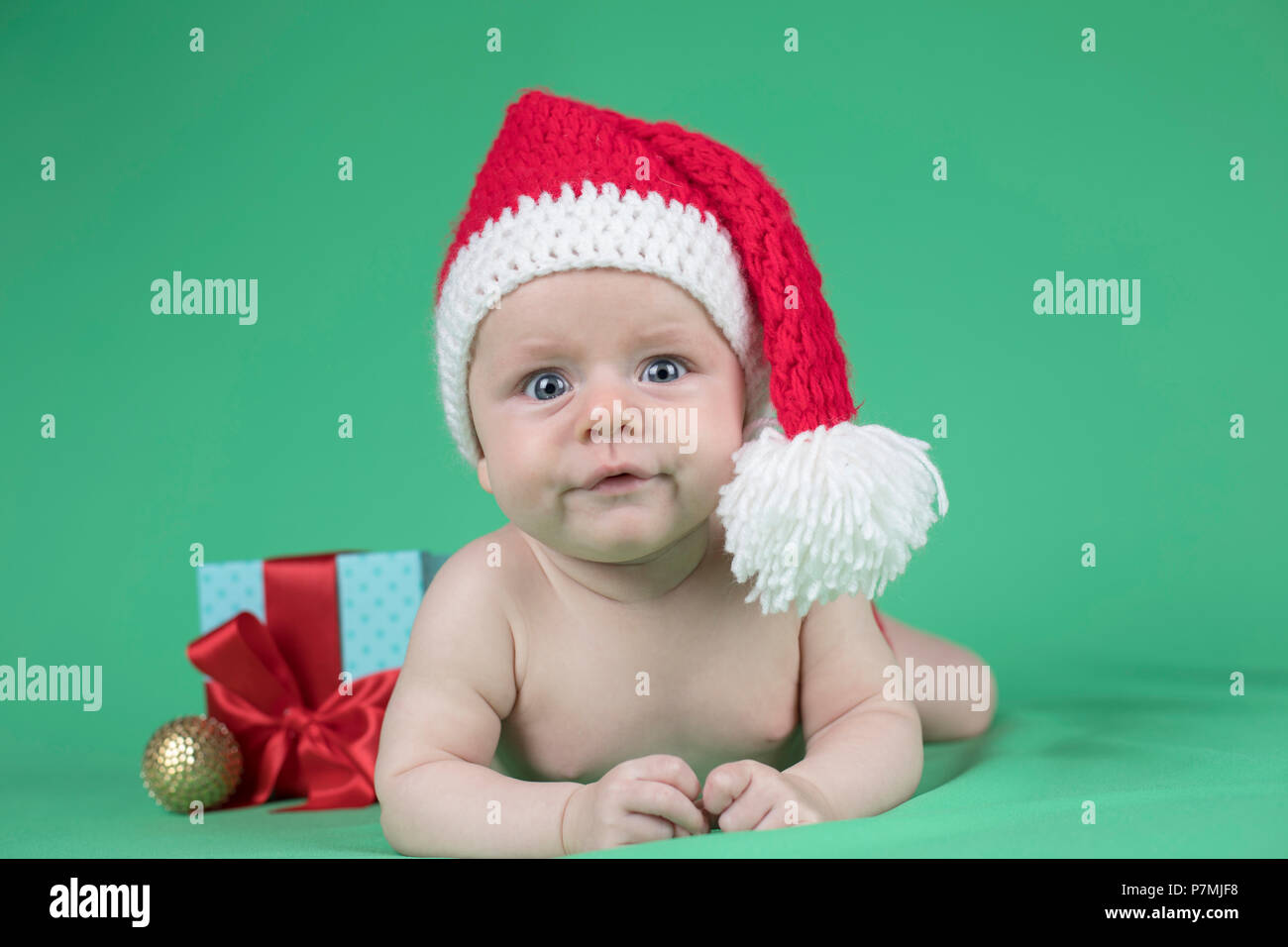 Baby in christmas hat Stock Photo - Alamy
