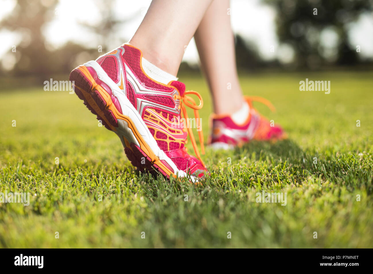 Runner feet running on road closeup on shoe Stock Photo Alamy