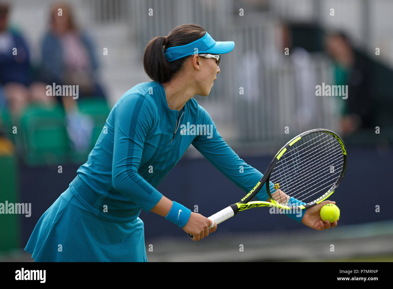 Professional tennis player Saisai Zheng (Zheng Saisai) preparing to serve during a match. Stock Photo