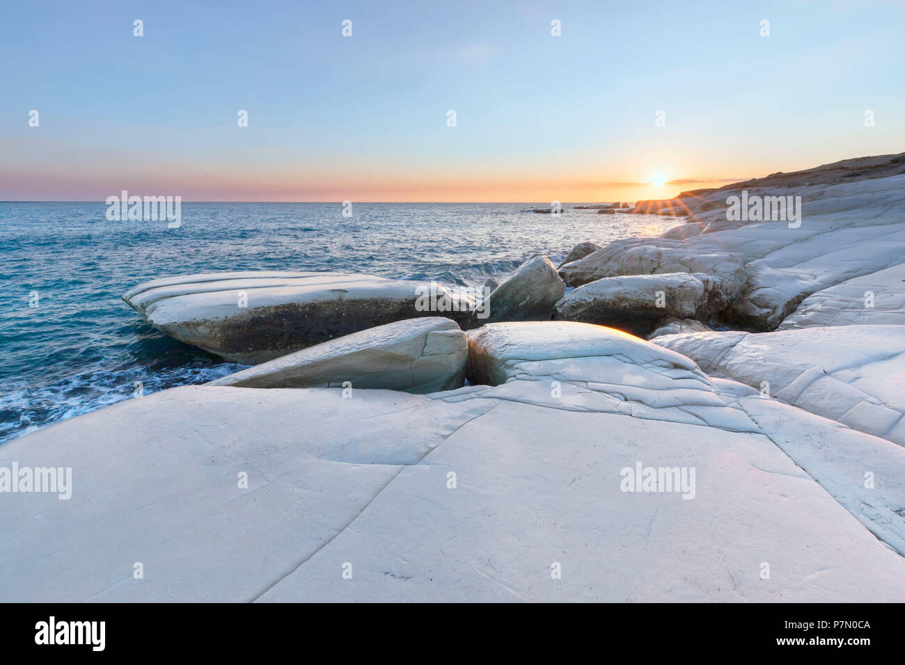 Cyprus, Limassol, The crystal water and the white rocks of Governor's Beach at sunrise Stock Photo