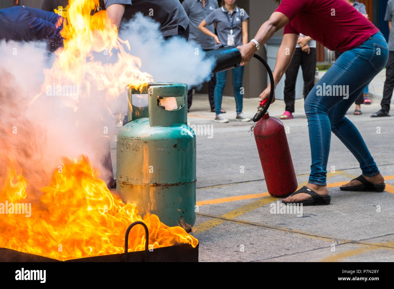 Employees firefighting training,Extinguish a fire at the gas cylinder. Stock Photo
