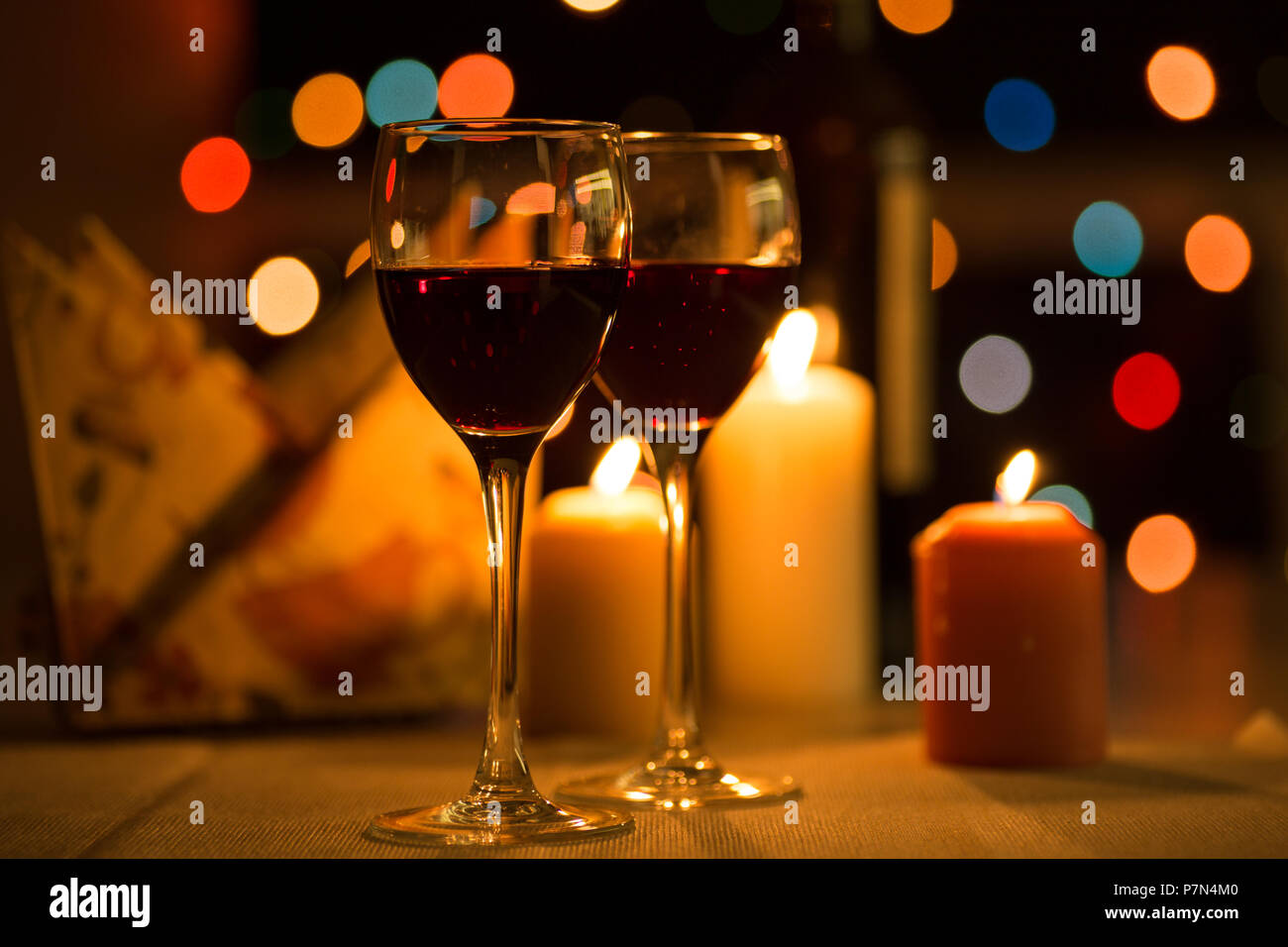 Romantic dinner in restaurant with candles and wine Stock Photo Alamy