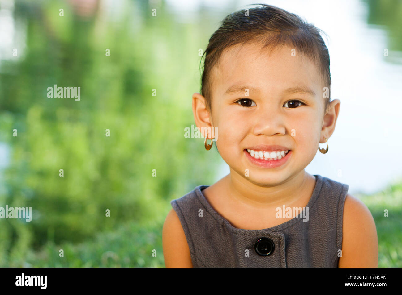 Portrait of an Asian little girl smiling Stock Photo - Alamy